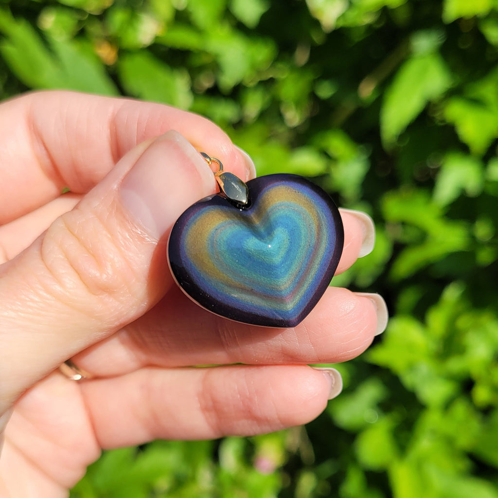 Pendentif coeur en obsidienne oeil céleste 2,4 cm bélière dorée