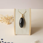 Grand pendentif obsidienne oeil céleste 6,2 cm wire wrapping doré