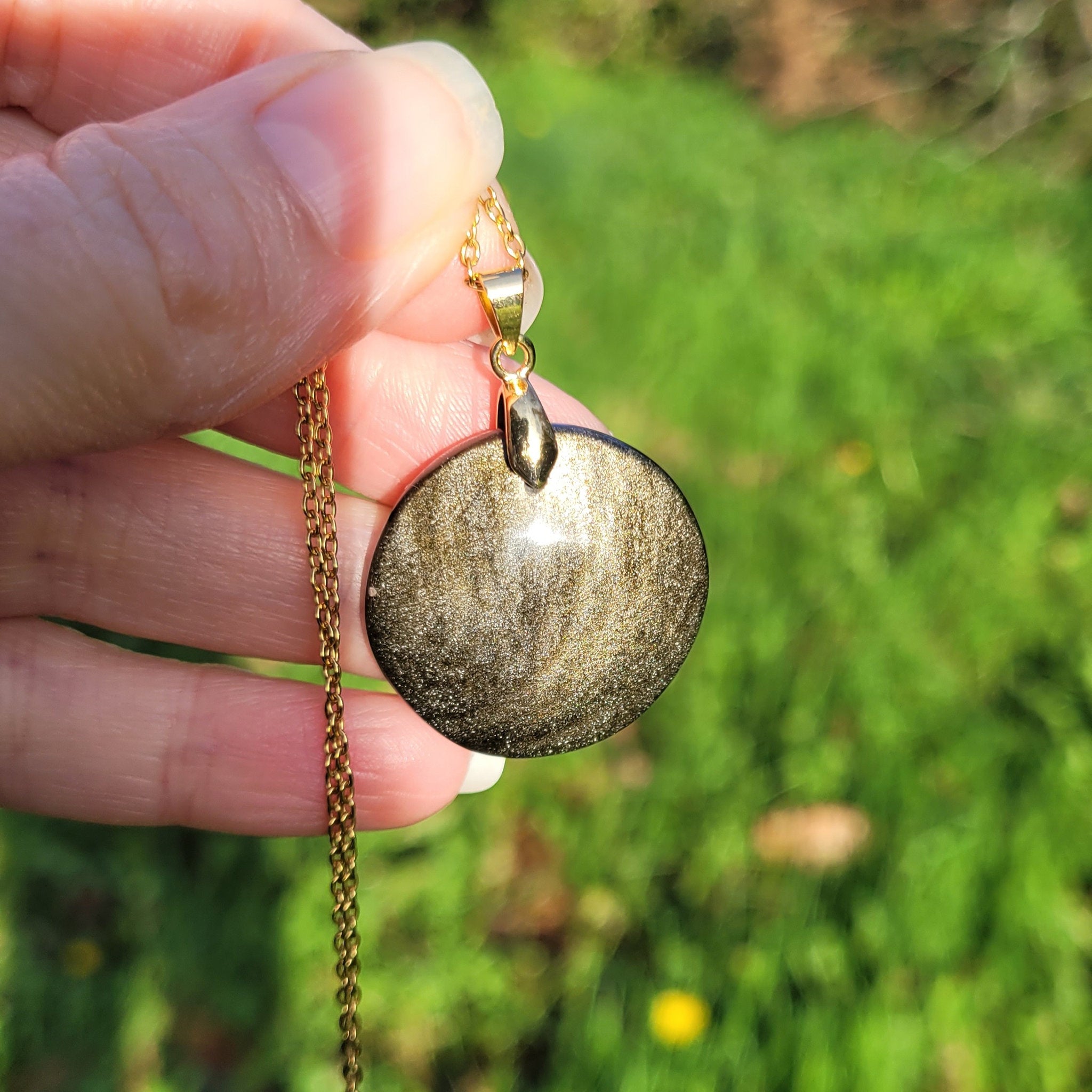 Pendentif obsidienne dorée 2,7 cm bélière dorée