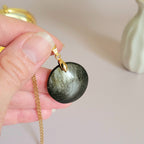 Pendentif obsidienne dorée 2,7 cm bélière dorée