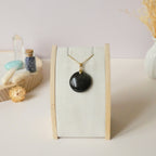 Pendentif obsidienne dorée 2,7 cm bélière dorée