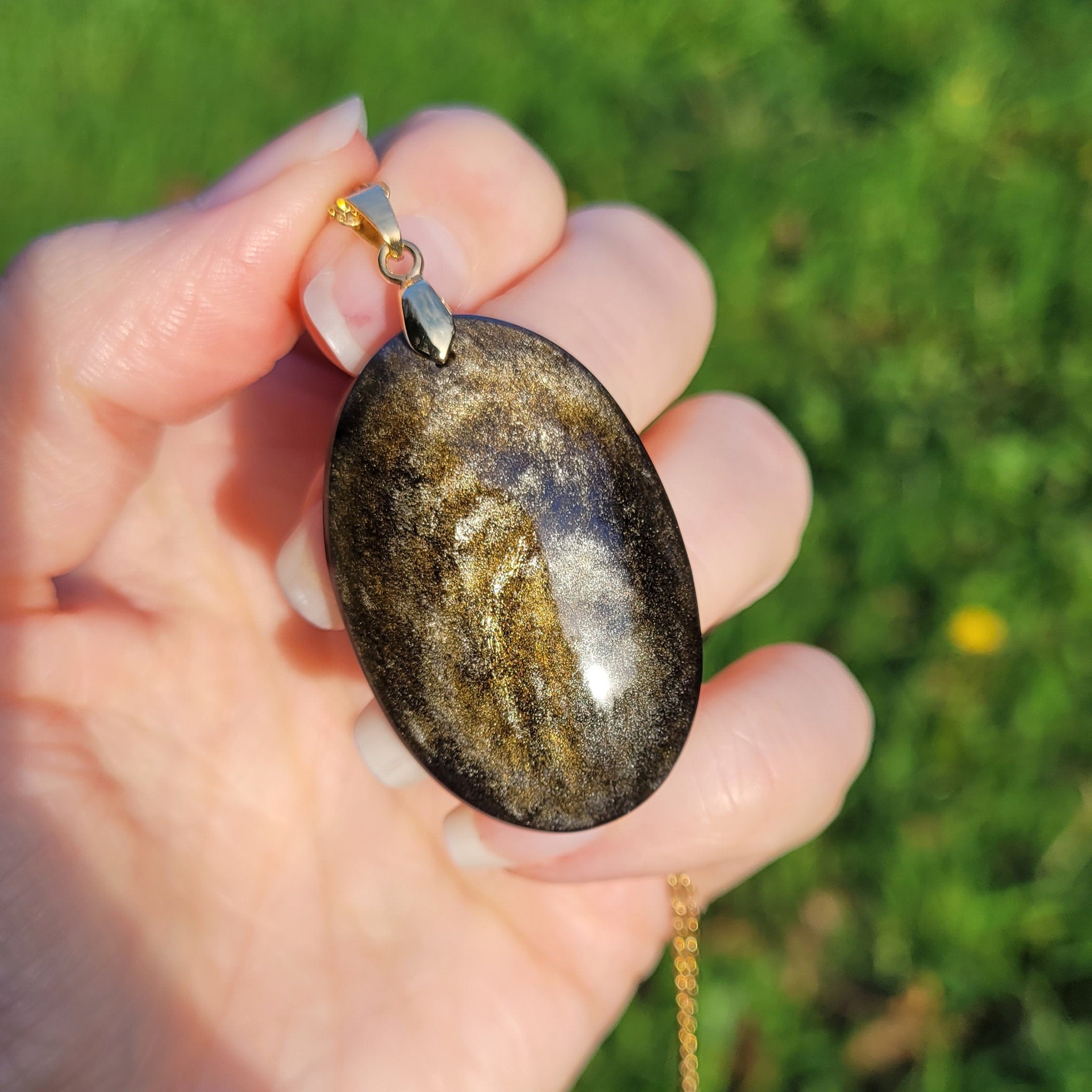 Pendentif obsidienne dorée 4,1 cm bélière dorée