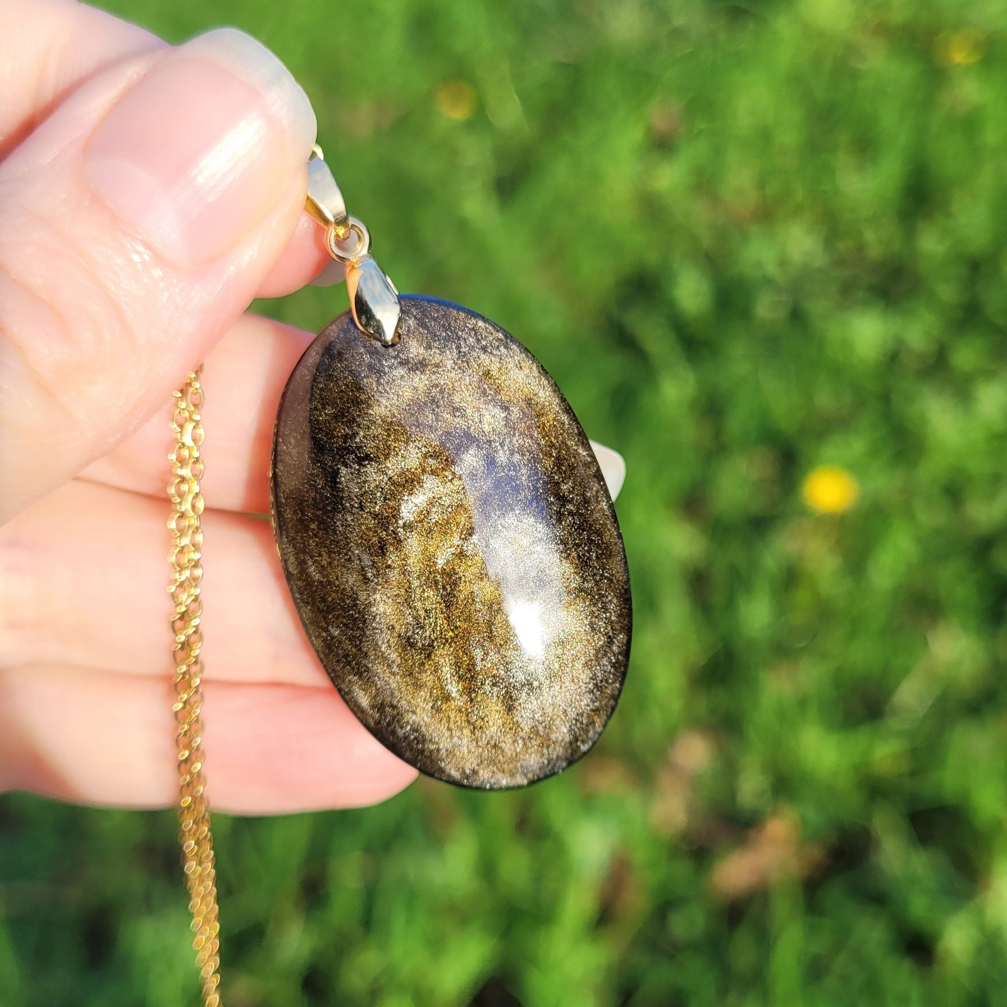 Pendentif obsidienne dorée 4,1 cm bélière dorée