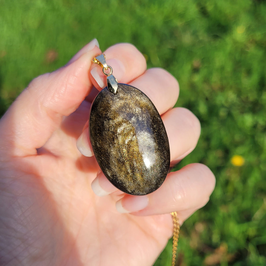 Pendentif obsidienne dorée 4,1 cm bélière dorée