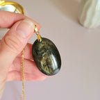 Pendentif obsidienne dorée 4,1 cm bélière dorée