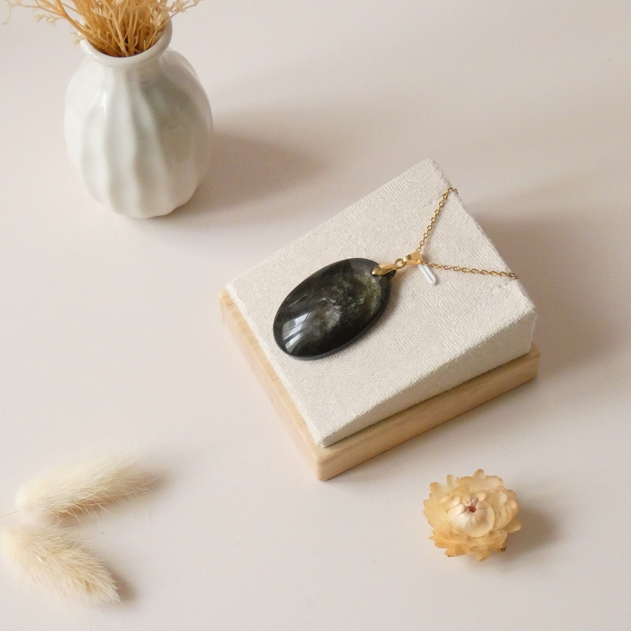 Pendentif obsidienne dorée 4,1 cm bélière dorée