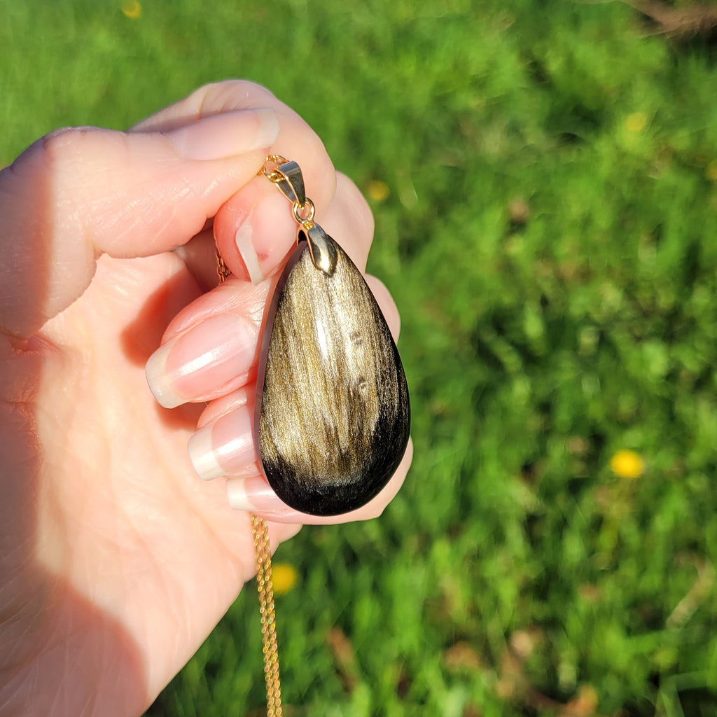 Pendentif obsidienne dorée 4,3 cm bélière dorée