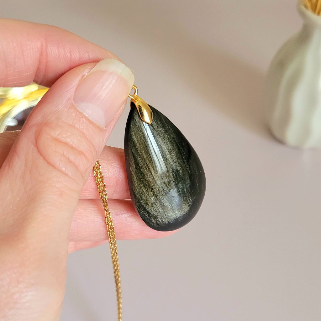 Pendentif obsidienne dorée 4,3 cm bélière dorée