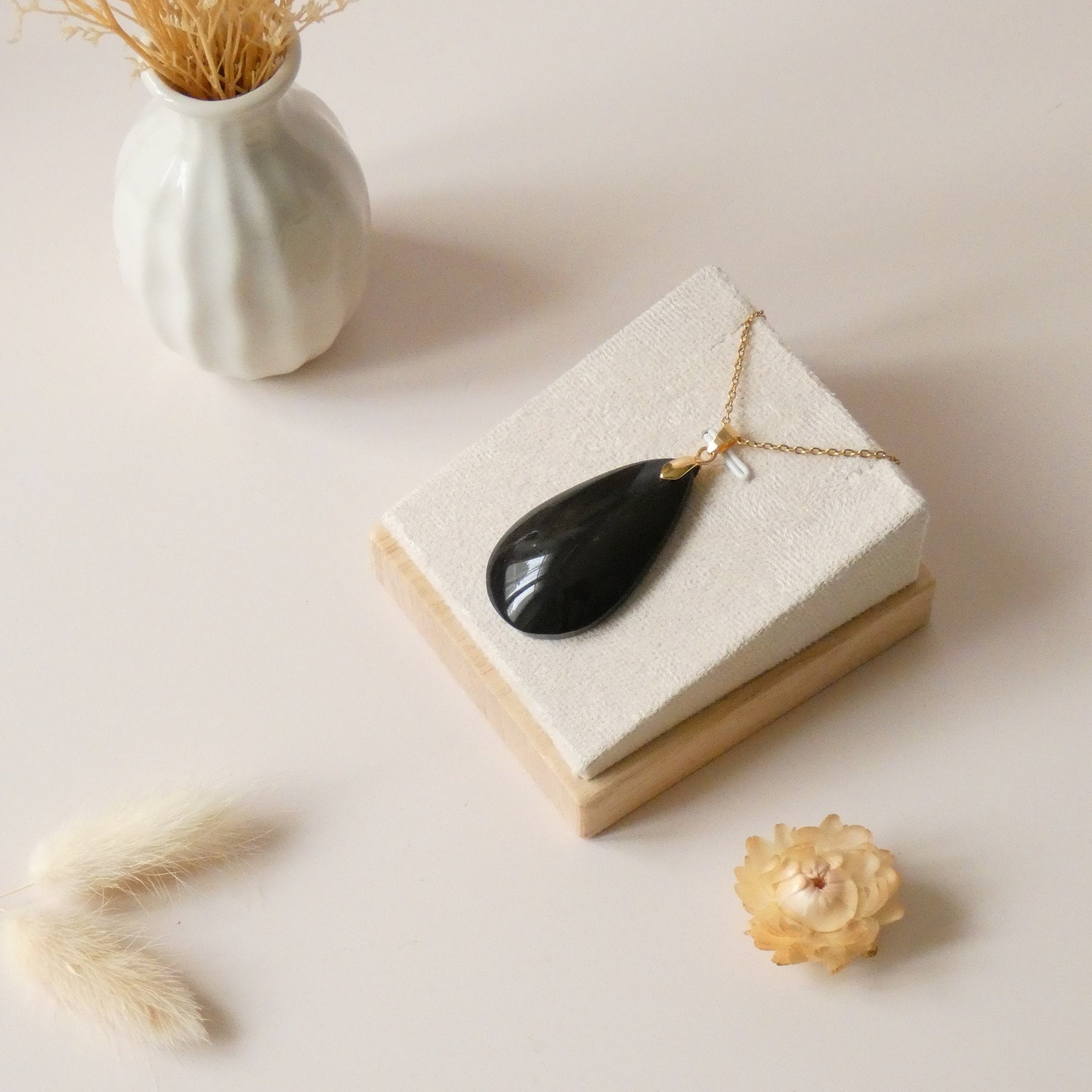 Pendentif obsidienne dorée 4,3 cm bélière dorée