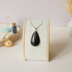 Pendentif obsidienne dorée 4,3 cm bélière dorée