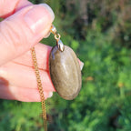Pendentif obsidienne dorée 3,9 cm bélière dorée