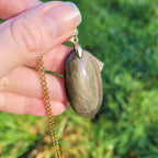 Pendentif obsidienne dorée 3,9 cm bélière dorée