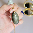 Pendentif obsidienne dorée 3,9 cm bélière dorée