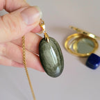 Pendentif obsidienne dorée 3,9 cm bélière dorée