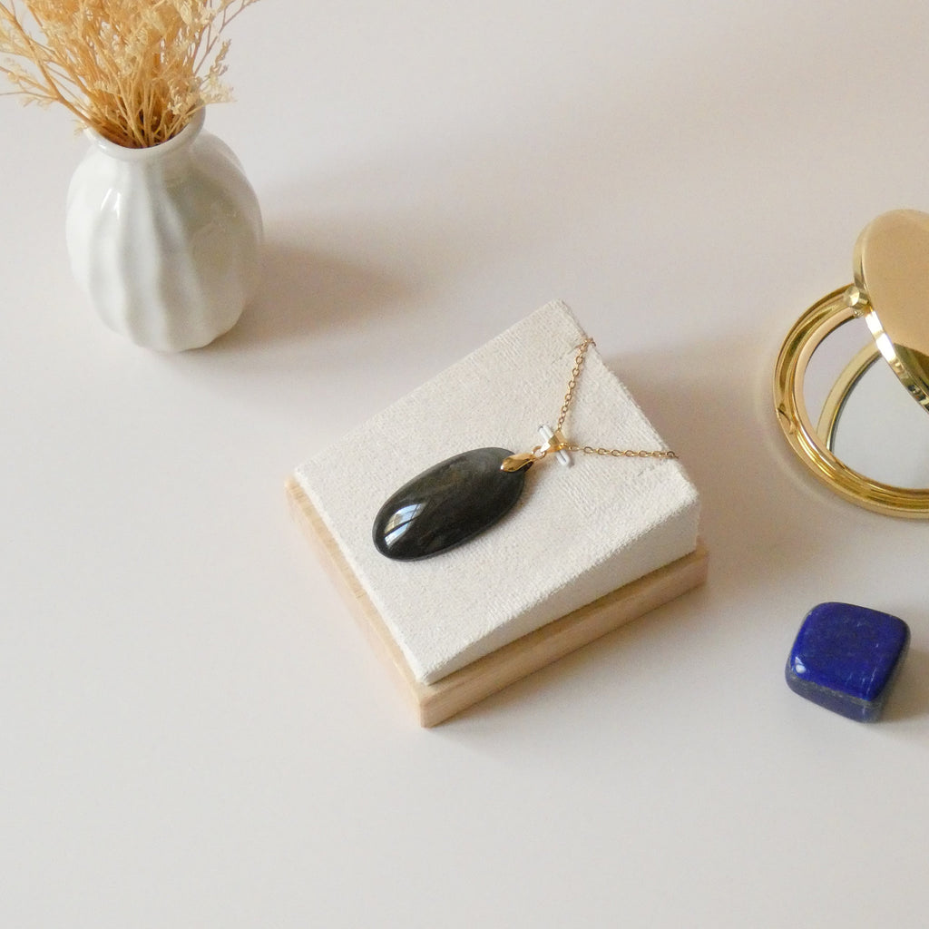 Pendentif obsidienne dorée 3,9 cm bélière dorée