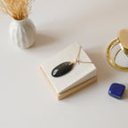 Pendentif obsidienne dorée 3,9 cm bélière dorée