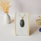 Pendentif obsidienne dorée 3,9 cm bélière dorée