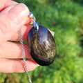 Pendentif obsidienne dorée 4 cm bélière argentée
