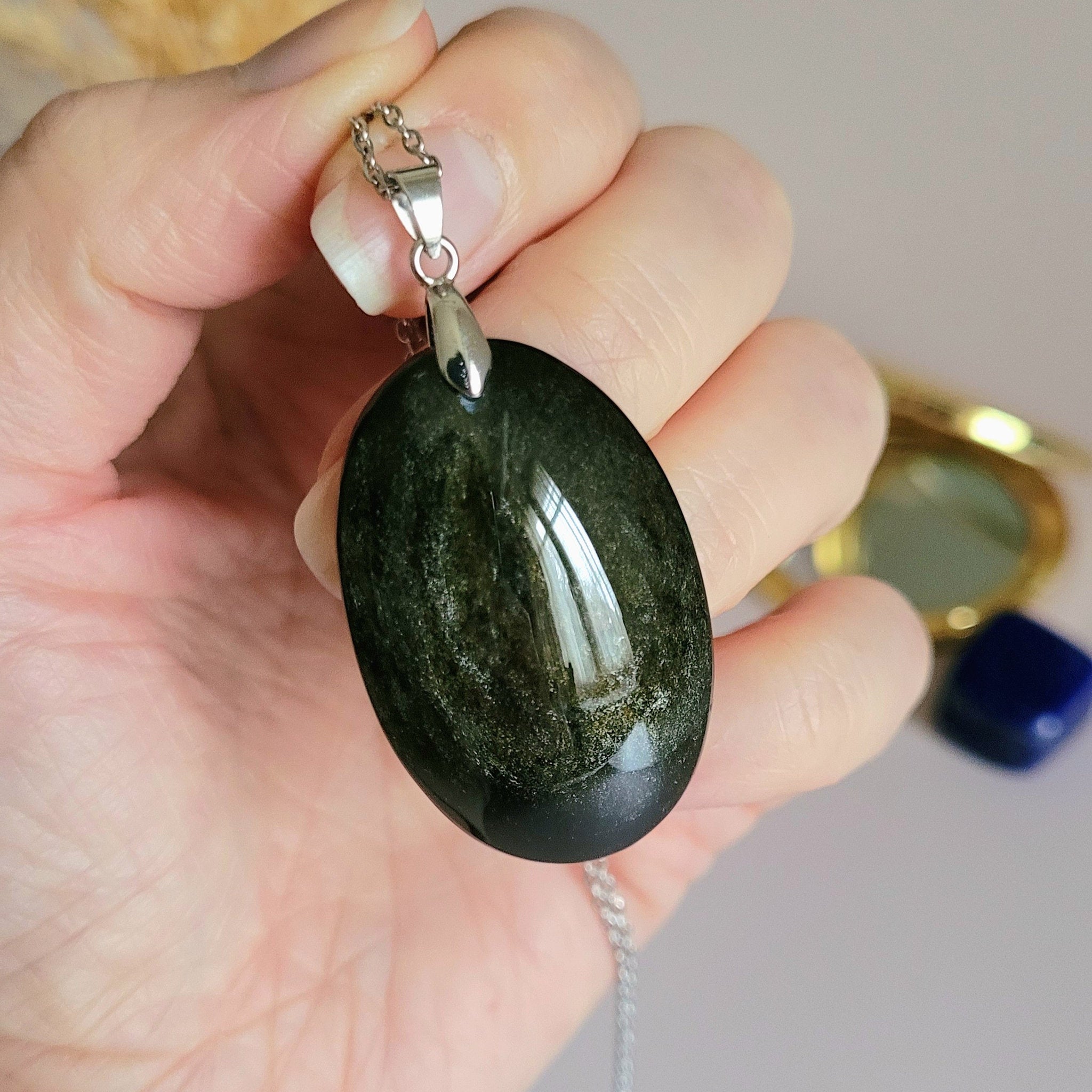 Pendentif obsidienne dorée 4 cm bélière argentée