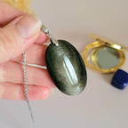 Pendentif en obsidienne dorée 4,3 cm bélière argentée