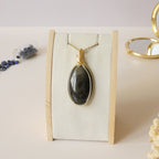 Pendentif obsidienne dorée 6,2 cm wire wrapping doré