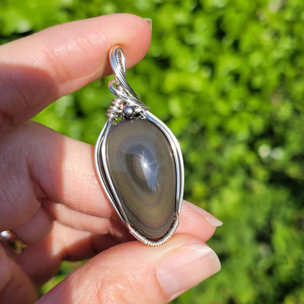 Pendentif obsidienne oeil céleste 4,8 cm wire wrapping argenté
