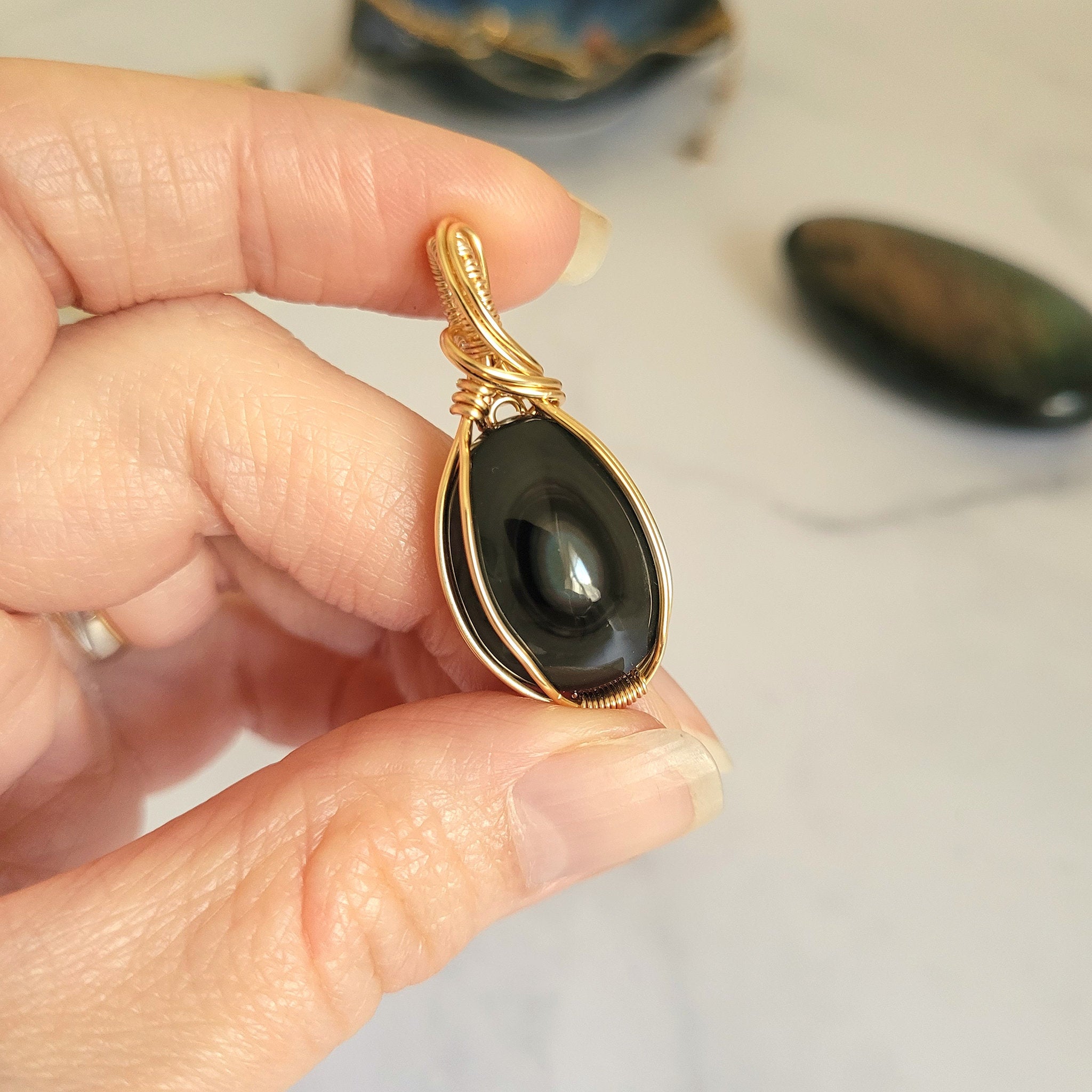 Pendentif obsidienne oeil céleste 3,8 cm wire wrapping