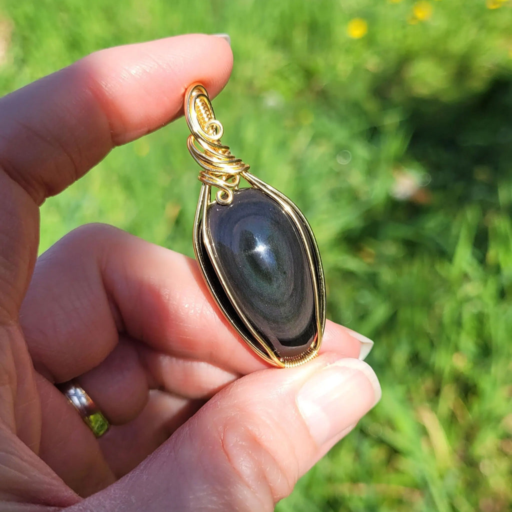 Pendentif obsidienne oeil céleste - wire wrapping doré - pierre naturelle