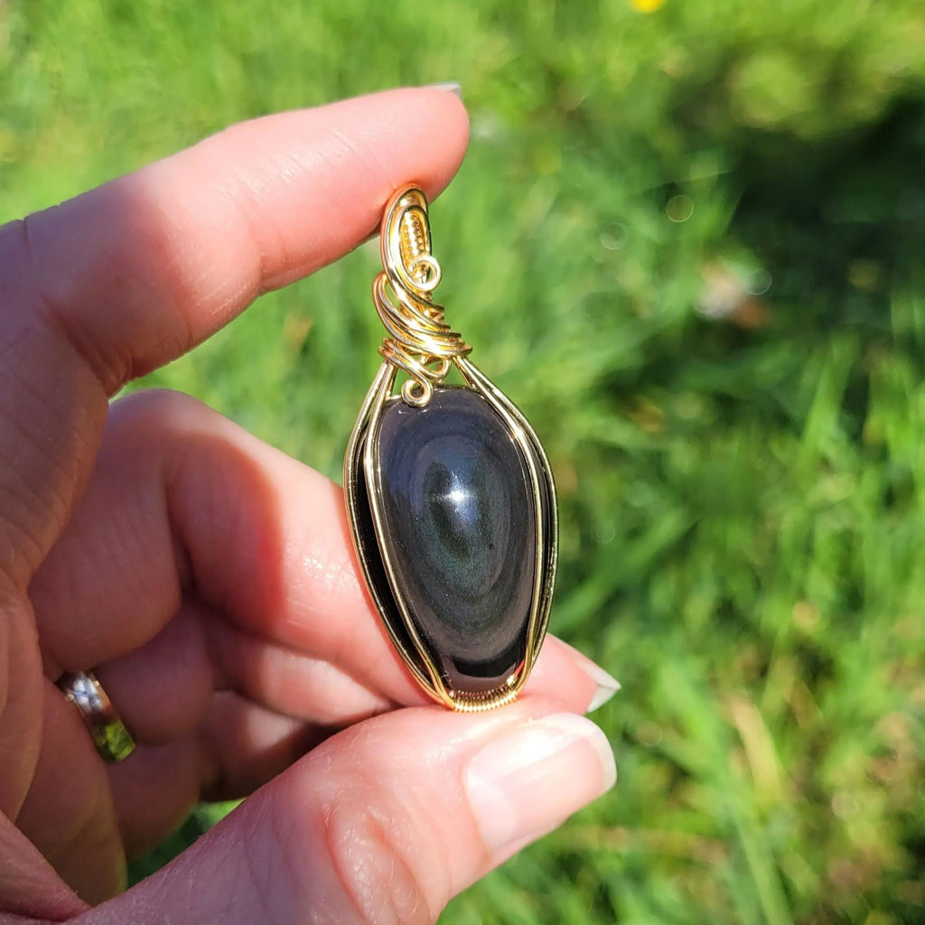 Pendentif obsidienne oeil céleste - wire wrapping doré - pierre naturelle