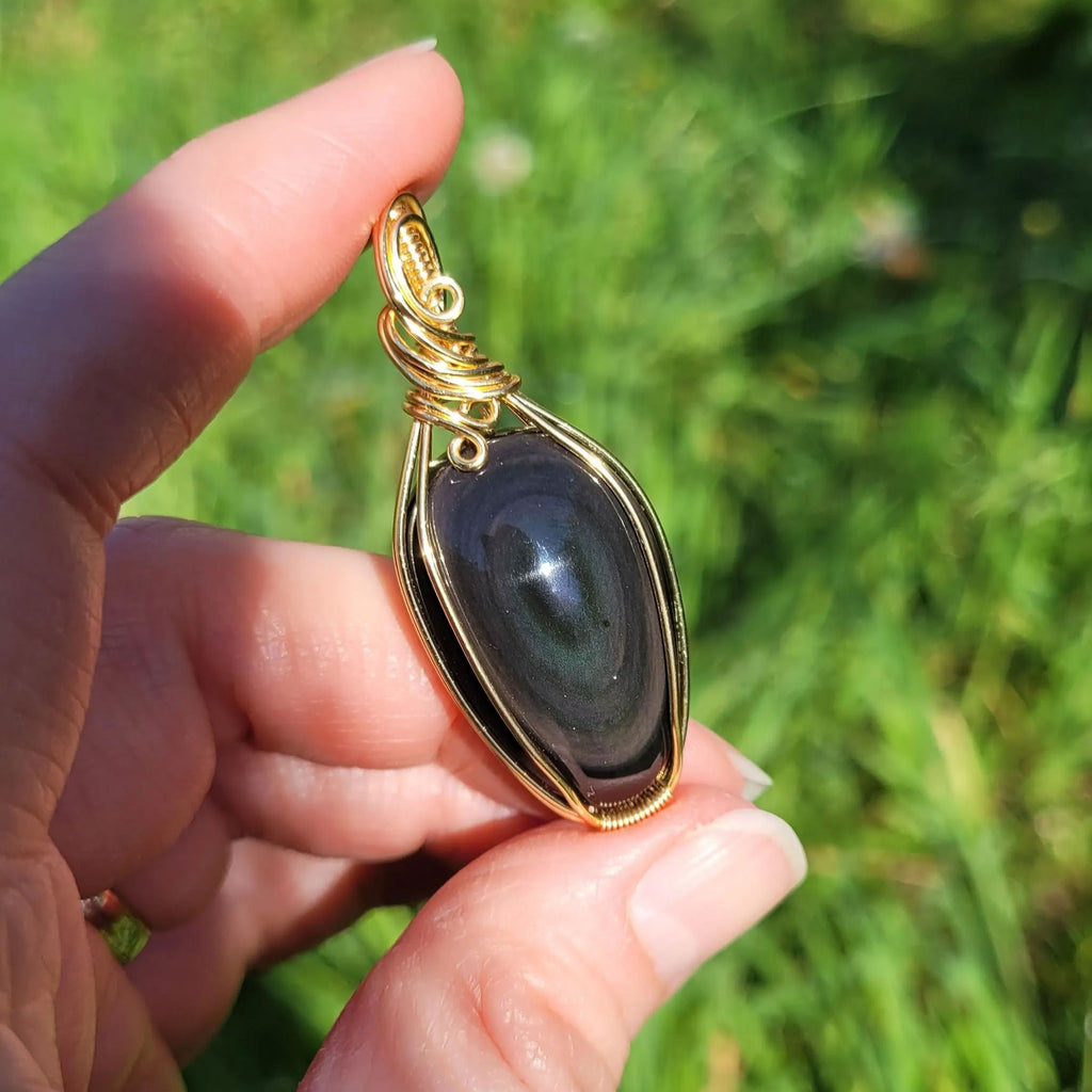 Pendentif obsidienne oeil céleste - wire wrapping doré - pierre naturelle