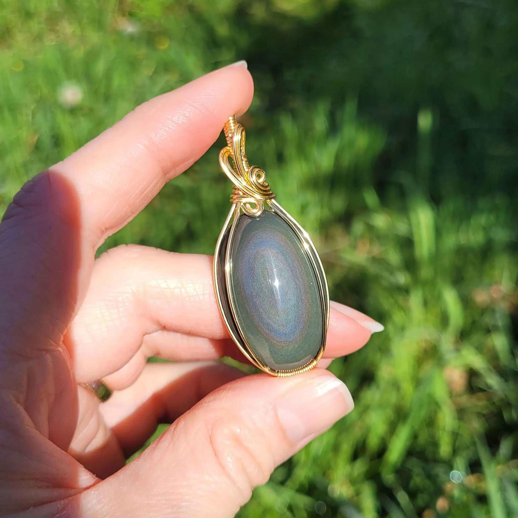 Pendentif obsidienne oeil céleste - wire wrapping doré - pierre naturelle