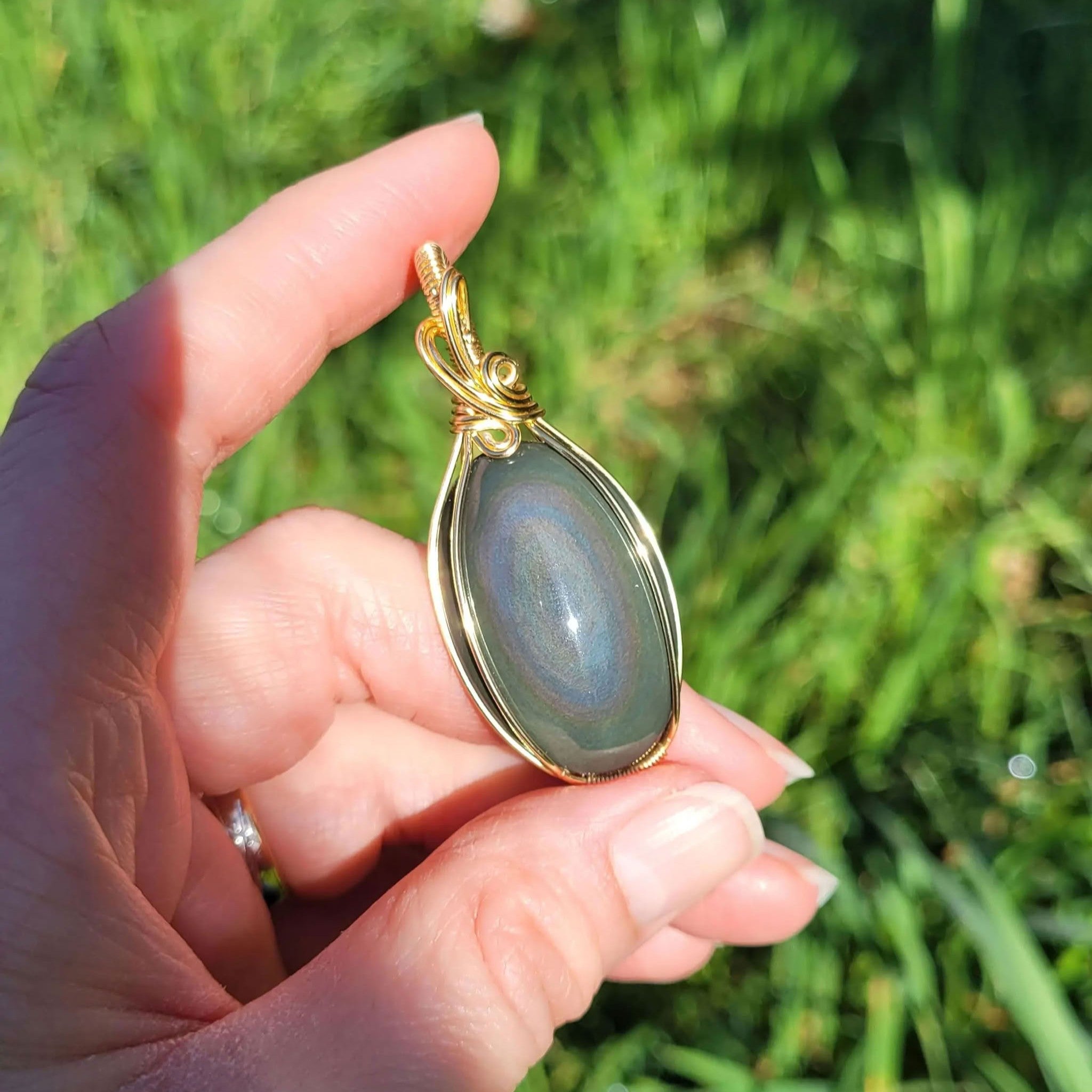 Pendentif obsidienne oeil céleste - wire wrapping doré - pierre naturelle