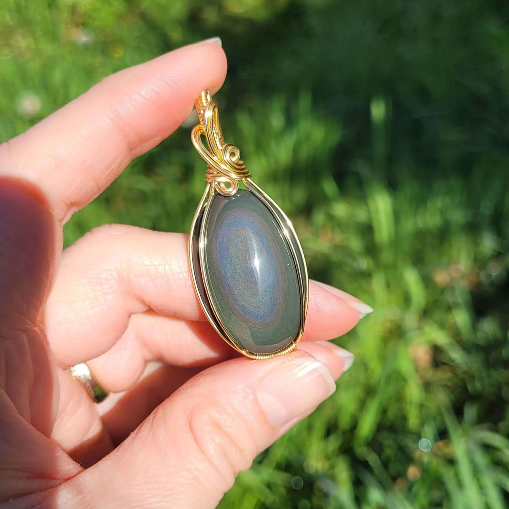 Pendentif obsidienne oeil céleste - wire wrapping doré - pierre naturelle