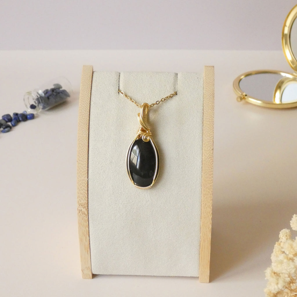 Pendentif obsidienne oeil céleste 4,8 cm wire wrapping doré