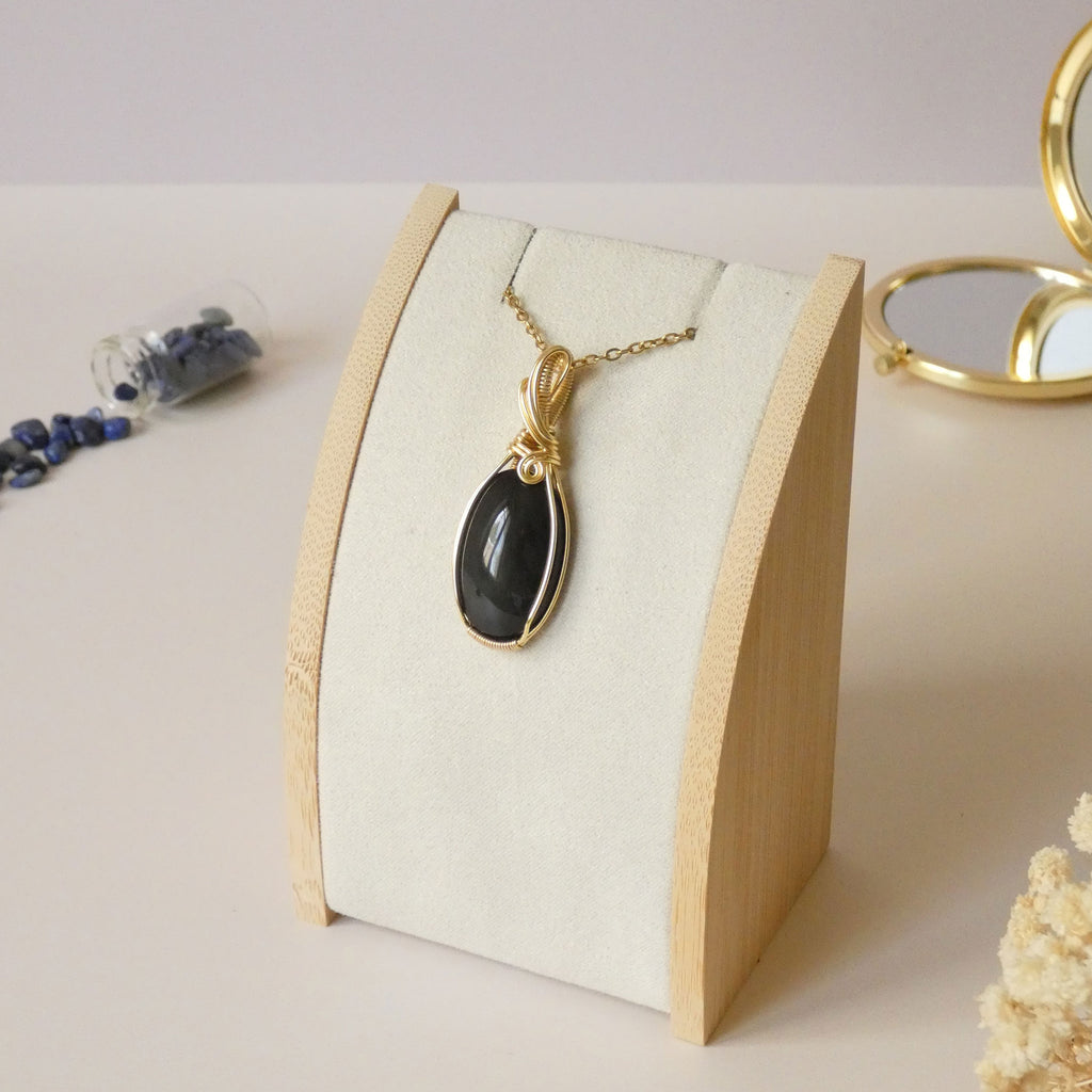 Pendentif obsidienne oeil céleste 4,8 cm wire wrapping doré