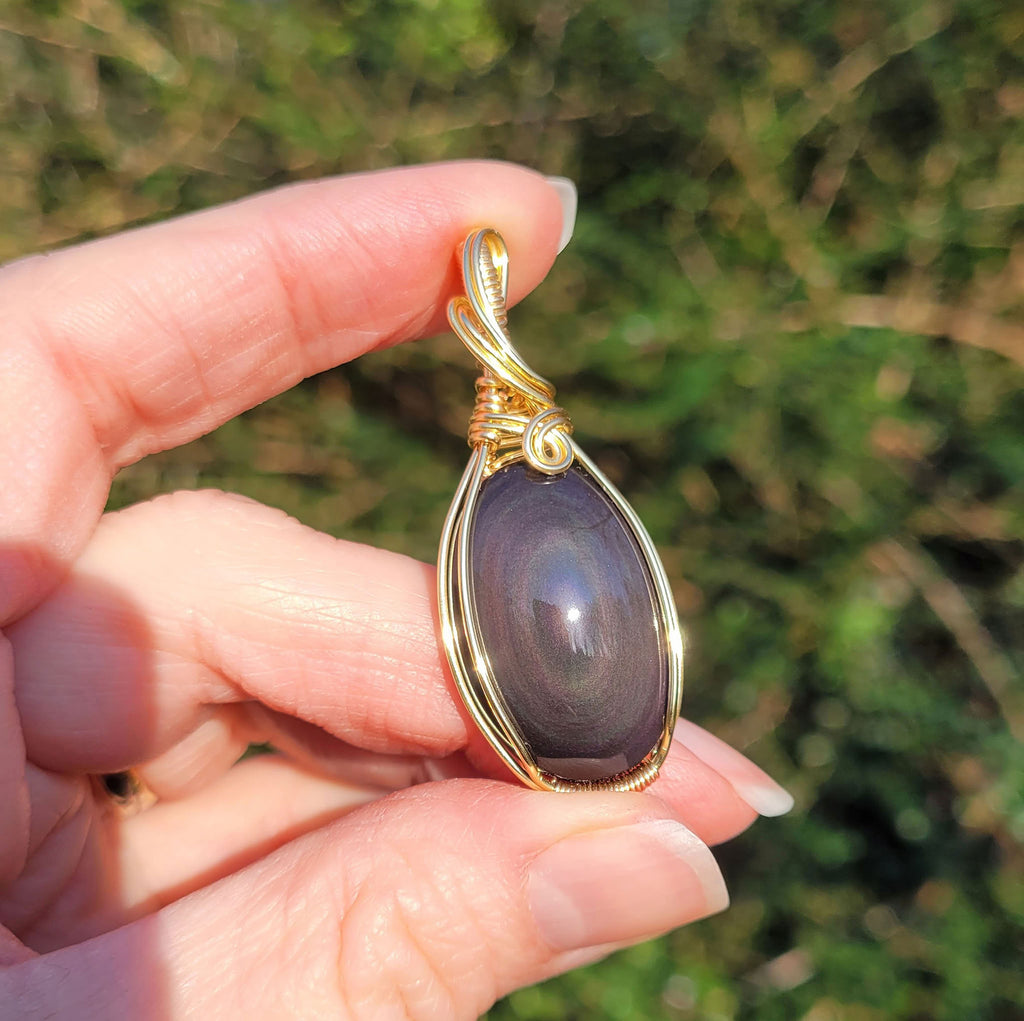 Pendentif obsidienne oeil céleste 4,8 cm wire wrapping doré