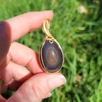 Pendentif obsidienne oeil céleste 4,6 cm wire wrapping doré