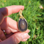 Pendentif obsidienne oeil céleste 4,6 cm wire wrapping doré