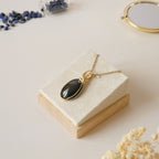 Pendentif obsidienne oeil céleste 4,6 cm wire wrapping doré