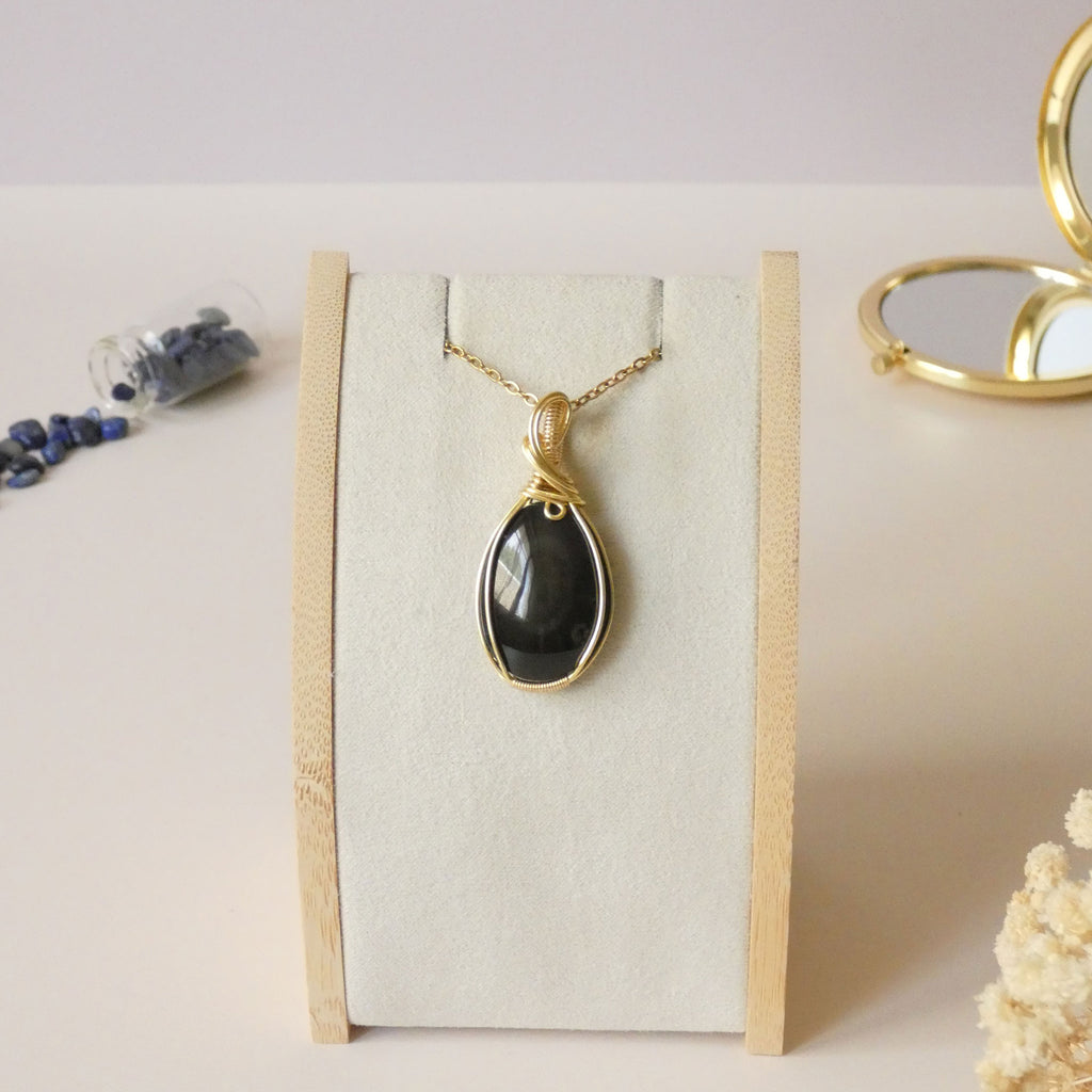 Pendentif obsidienne oeil céleste 4,6 cm wire wrapping doré