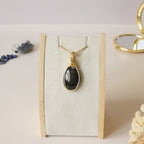 Pendentif obsidienne oeil céleste 4,6 cm wire wrapping doré