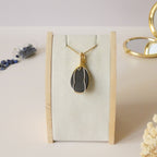 Pendentif obsidienne oeil céleste 4,6 cm wire wrapping doré
