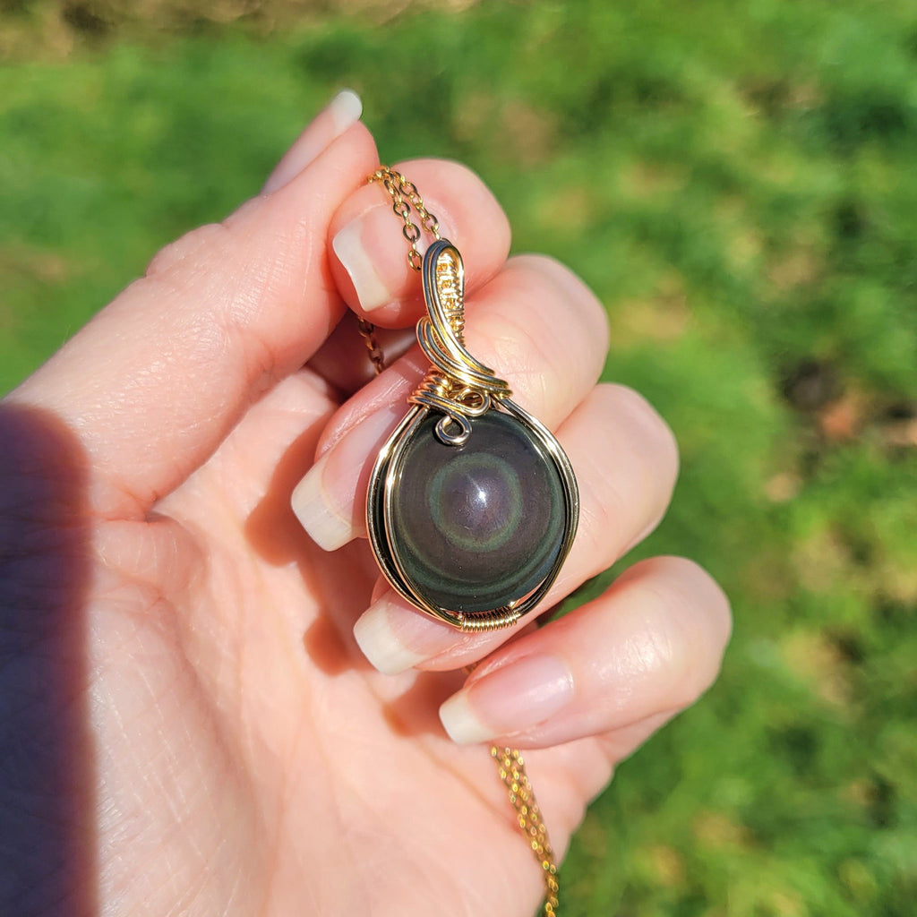 Pendentif en obsidienne oeil céleste wire wrapping doré – 3,8 cm
