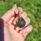 Pendentif en obsidienne oeil céleste wire wrapping doré – 3,8 cm