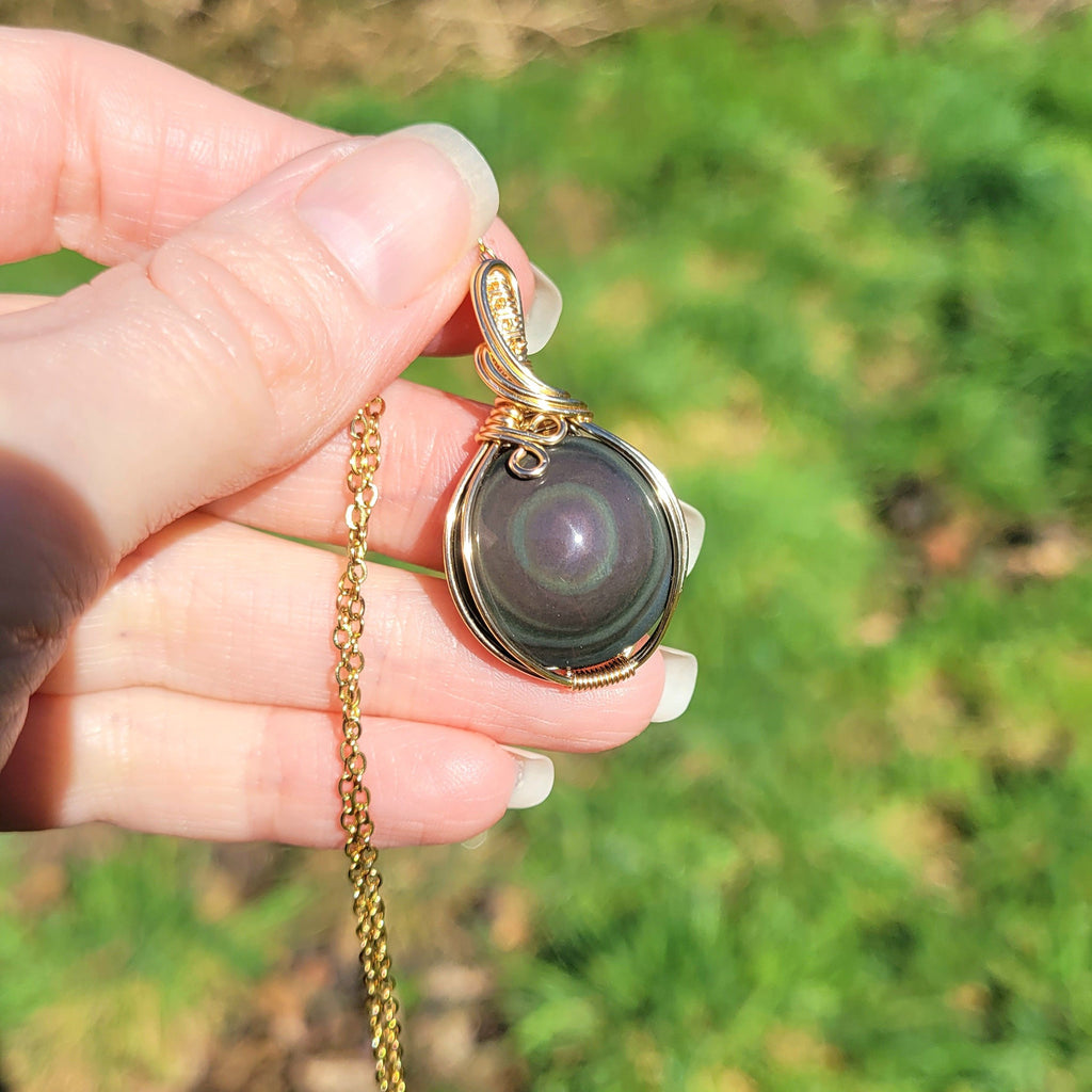 Pendentif en obsidienne oeil céleste wire wrapping doré – 3,8 cm