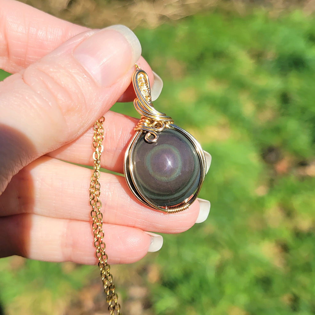 Pendentif en obsidienne oeil céleste wire wrapping doré – 3,8 cm