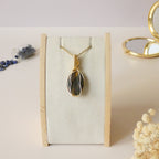 Pendentif oeil de tigre et faucon 4,6 cm wire wrapping doré