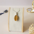 Pendentif oeil de tigre 4,6 cm wire wrapping argenté