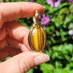 Pendentif oeil de tigre 4,4cm wire wrapping doré
