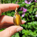 Pendentif oeil de tigre 4,4cm wire wrapping doré
